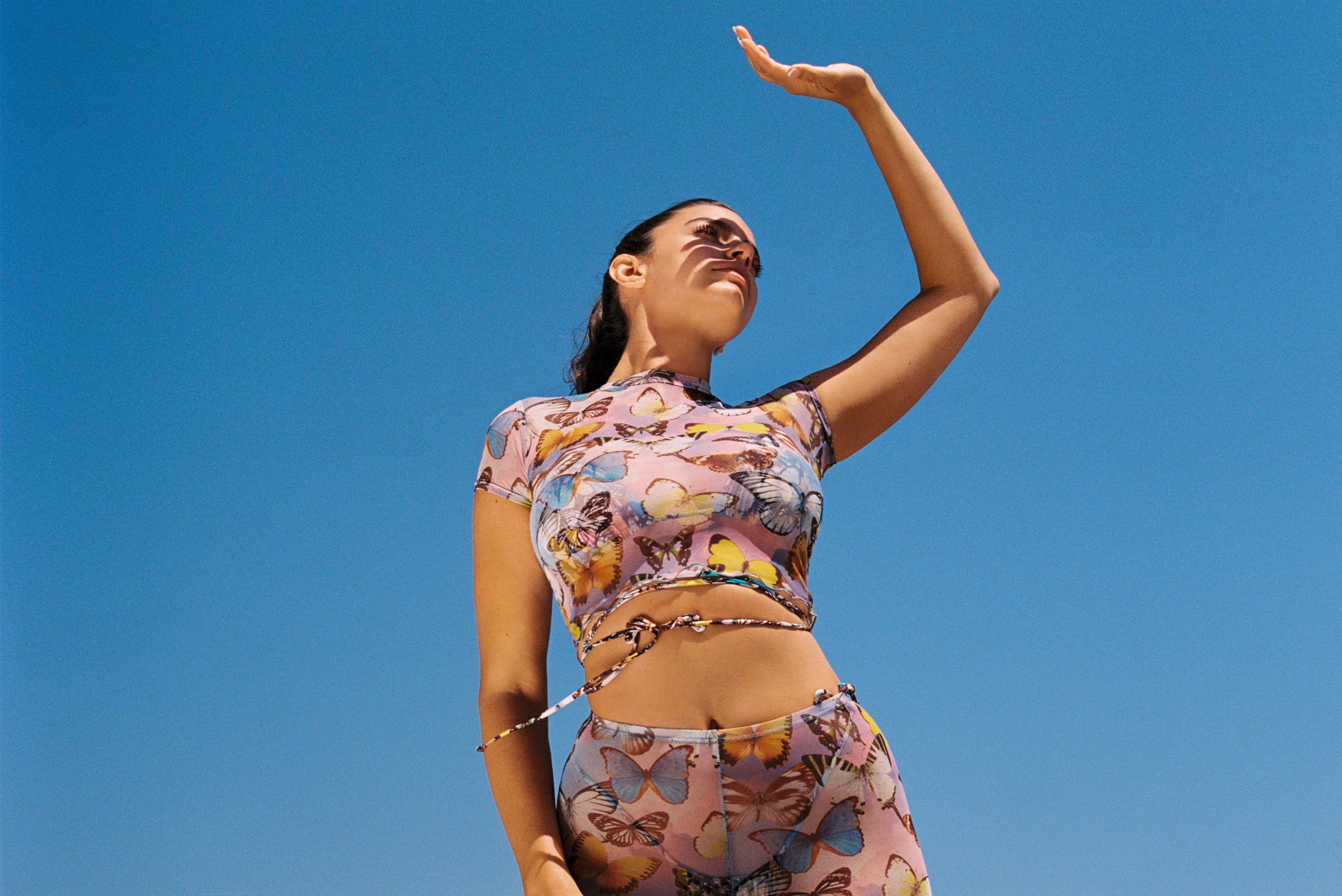 Woman wearing a butterfly printed shirt and pants